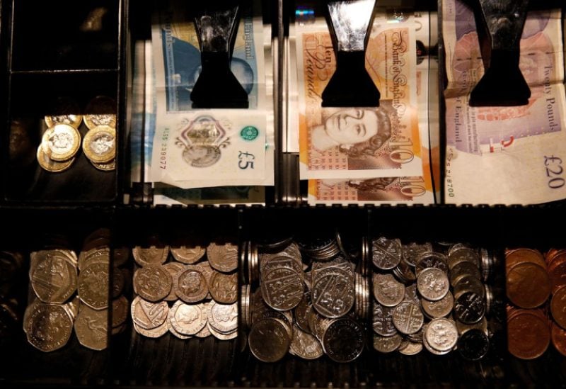 Pound Sterling notes and change are seen inside a cash resgister in a coffee shop in Manchester, Britain, Septem,ber 21, 2018. REUTERS/Phil Noble