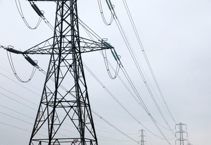 Electricity pylons are seen in Wellingborough, Britain, March 30, 2022. REUTERS/Andrew Boyers/File Photo