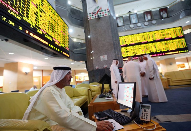 An investor monitors a screen displaying stock information at the Abu Dhabi Securities Exchange June 25, 2014.