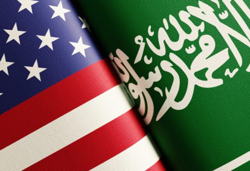 Flags of Saudi Arabia and US.