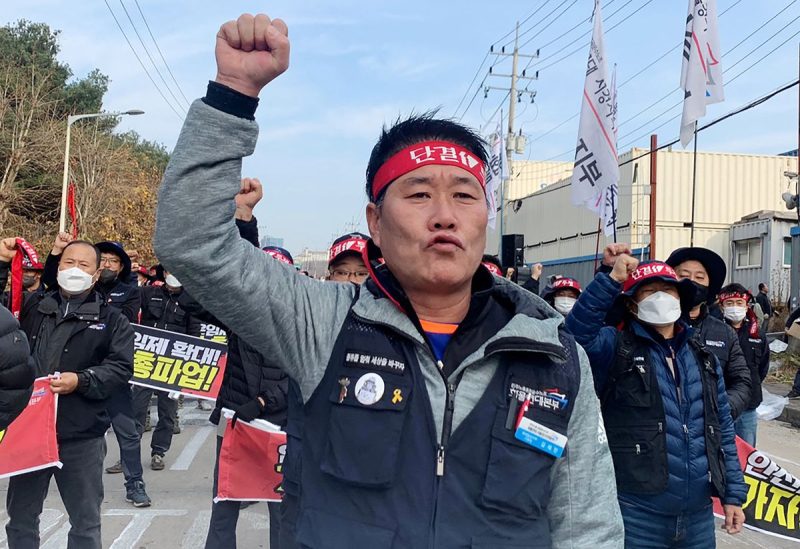 Unionized truckers shout slogans during their rally as they kick off their strike in front of transport hub Uiwang, south of Seoul, South Korea November 24, 2022. REUTERS/Ju-min Park