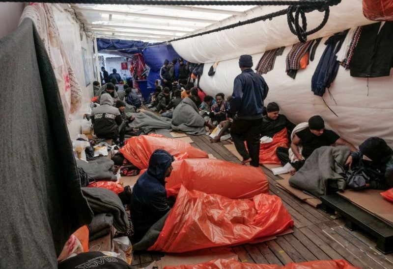 Migrants sleep on deck of NGO rescue ship 'Ocean Viking', in the Mediterranean Sea, November 6, 2022. Camille Martin Juan/Sos Mediterranee/Handout via REUTERS