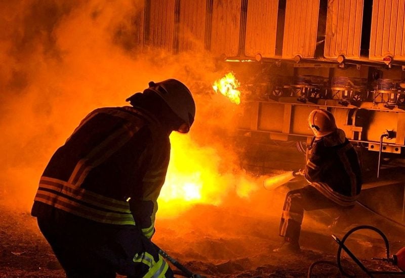 Firefighters work to put out a fire at energy infrastructure facilities, damaged by Russian missile strike, as Russia's attack on Ukraine continues, in Kyiv region, Ukraine November 15, 2022. State Emergency Service of Ukraine/Handout via REUTERS