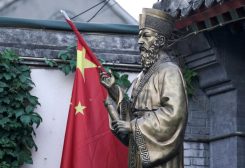 A Chinese flag is seen next to the statue of Italian Jesuit Matteo Ricci, the first builder of church during the Ming Dynasty, at the entrance of Beijing South Catholic Church, a government-sanctioned Catholic church, in Beijing, China September 29, 2018. REUTERS/Jason Lee/File Photo