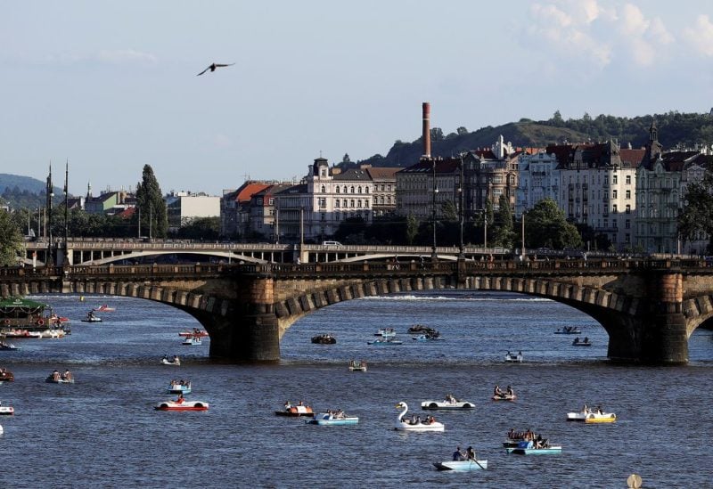 People ride pedal boats on the Vltava river following the coronavirus disease (COVID-19) outbreak, in Prague, Czech Republic, June 22, 2020. REUTERS/David W Cerny