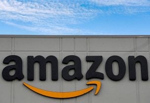 The Amazon logo is seen outside its JFK8 distribution center in Staten Island, New York, U.S. November 25, 2020. REUTERS/Brendan McDermid
