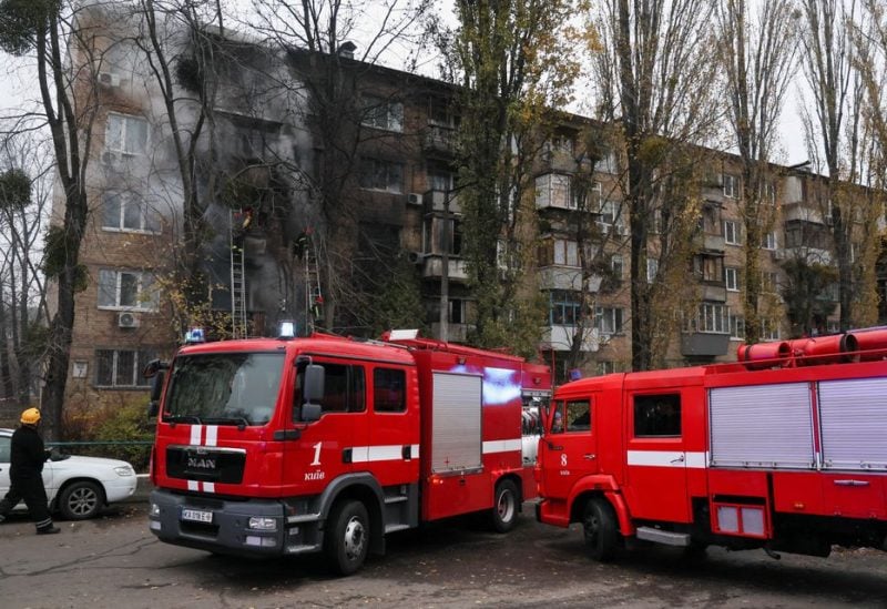 Firefighters work to put out a fire in a residential building hit by a Russian strike, amid Russia's attack on Ukraine, in Kyiv, Ukraine November 15, 2022. REUTERS