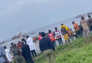 People look at Precision Air plane that crushed into Lake Victoria, Tanzania, in this still image obtained from a social media video. Kanyika/ @startvtanzania1/via REUTERS
