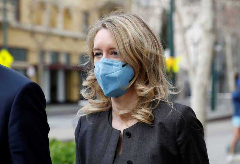 Theranos founder Elizabeth Holmes and her family leave the federal courthouse after attending her fraud trial in San Jose, California, U.S. January 3, 2022. REUTERS/Brittany Hosea-Small