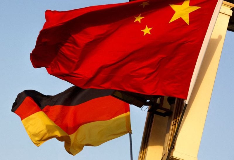 German and Chinese national flags fly in Tiananmen Square ahead of the visit of German Chancellor Angela Merkel in Beijing, China, May 23, 2018. REUTERS/Thomas Peter/File Photo/File Photo