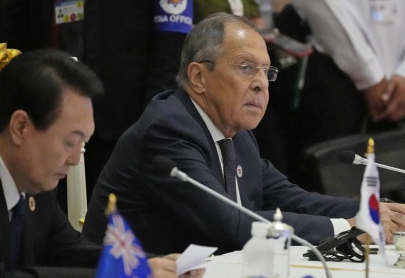 FILE - Sitting next to South Korea President Yoon Suk Yeol, left, Russian Foreign Minister Sergey Lavrov listens during the ASEAN Australia-New Zealand Trade Area (AANZTA) in Phnom Penh, Cambodia, Sunday, Nov. 13, 2022. Lavrov has been taken to the hospital after suffering a health problem following his arrival for the Group of 20 summit in Bali, Indonesian authorities said Monday. (AP Photo/Heng Sinith, File)