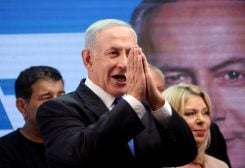 FILE PHOTO: Former Israeli Prime Minister Benjamin Netanyahu gestures as he addresses his supporters from a truck at a campaign event in the run up to Israel's election in Or Yehuda, Israel October 30, 2022. REUTERS/Nir Elias/File Photo