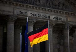 The German national flag flies in front of the Reichstag building, the seat of the lower house of the parliament Bundestag, in Berlin, Germany, April 5, 2022. REUTERS/Lisi Niesner/File Photo