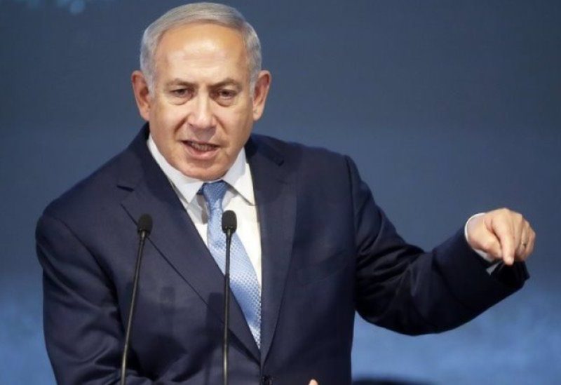 Israeli Prime Minister Benjamin Netanyahu gestures as he addresses his supporters from a truck at a campaign event in the run up to Israel's election in Or Yehuda, Israel October 30, 2022. REUTERS/Nir Elias/File Photo