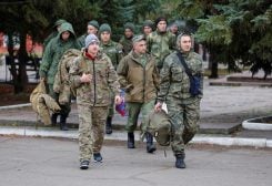 Conscripts, including students who returned from the Russian military units after they were demobilized, walk to attend an acknowledgment ceremony in the course of Russia-Ukraine conflict in the Donetsk region - REUTERS