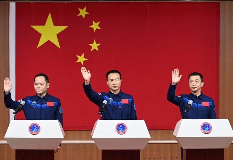 Astronauts Fei Junlong, Deng Qingming and Zhang Lu attend a news conference before the Shenzhou-15 spaceflight mission to build China's space station, at Jiuquan Satellite Launch Center, near Jiuquan, Gansu province, China November 28, 2022. cnsphoto via REUTERS ATTENTION EDITORS - THIS IMAGE WAS PROVIDED BY A THIRD PARTY. CHINA OUT.