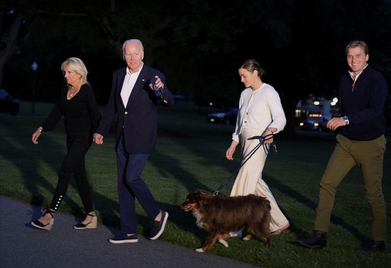 U.S. President Joe Biden, First lady Jill Biden, their granddaughter Naomi Biden, her fiance Peter Neal and dog "Charlie" walk from Marine One upon arrival to the White House, in Washington, U.S., June 20, 2022. REUTERS