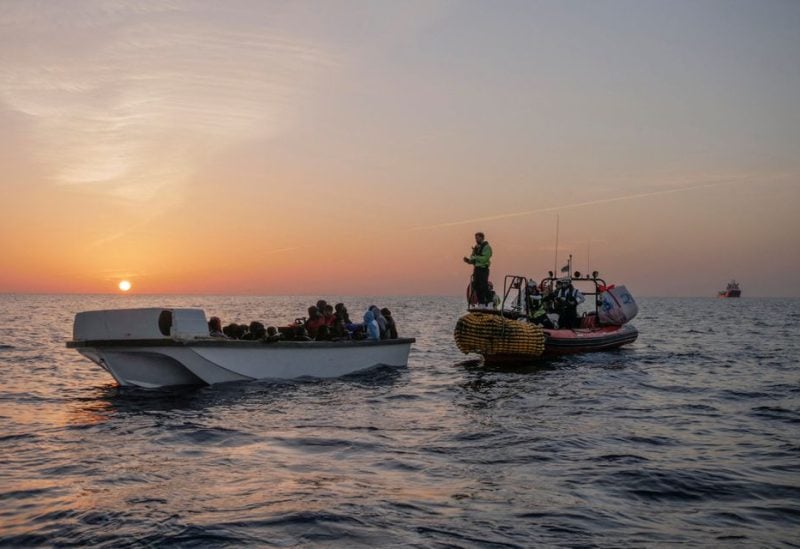Migrants wait to be rescued by crew members of NGO rescue ship 'Ocean Viking' in the Mediterranean Sea, October 26, 2022. Camille Martin Juan/Sos Mediterranee/Handout via REUTERS