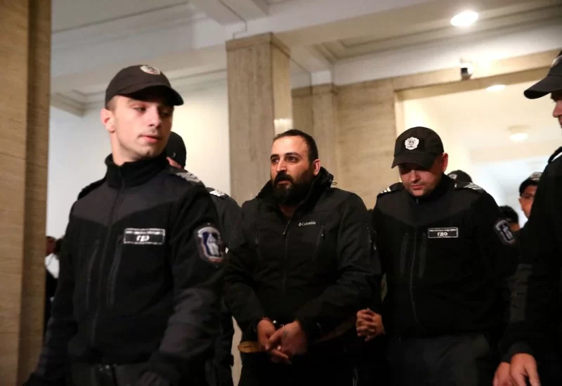 A man, charged for supporting terrorist acts in connection with an explosion in central Istanbul, is escorted to the courtroom, Sofia, Bulgaria, November 19, 2022. REUTERS