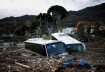 Damaged buses lie amongst debris following a landslide on the Italian holiday island of Ischia, Italy November 27, 2022. REUTERS/Guglielmo Mangiapane TPX IMAGES OF THE DAY