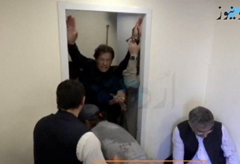 Former Pakistani Prime Minister Imran Khan is helped after he was shot in the shin in Wazirabad, Pakistan November 3, 2022 in this still image obtained from video. Urdu Media via REUTERS THIS IMAGE HAS BEEN SUPPLIED BY A THIRD PARTY. MANDATORY CREDIT. NO RESALES. NO ARCHIVES. PAKISTAN OUT. NO COMMERCIAL OR EDITORIAL SALES IN PAKISTAN