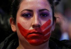 A demonstrator with a red paint on her face attends a protest to mark the International Day for the Elimination of Violence against Women in Madrid, Spain, November 25, 2022. REUTERS/Violeta Santos Moura TPX IMAGES OF THE DAY