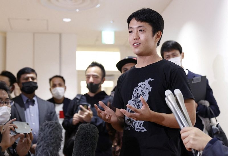 Toru Kubota, a Japanese filmmaker held by authorities in Myanmar since being arrested in July, and who has been freed on November 17th in Myanmar, speaks to the media upon his arrival at Haneda Airport, in Tokyo, Japan November 18, 2022. Mandatory credit Kyodo via REUTERS ATTENTION EDITORS - THIS IMAGE WAS PROVIDED BY A THIRD PARTY. MANDATORY CREDIT. JAPAN OUT. NO COMMERCIAL OR EDITORIAL SALES IN JAPAN
