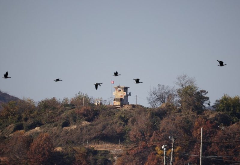 Birds fly over a North Korean guard post in this picture taken near the demilitarized zone separating the two Koreas, in Paju, South Korea, November 4, 2022. REUTERS/Kim Hong-Ji