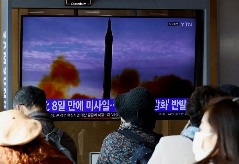 FILE PHOTO: People watch a TV broadcasting a news report, on North Korea firing a ballistic missile off its east coast, in Seoul, South Korea, November 17, 2022. REUTERS/Heo Ran/File Photo