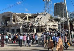 Civilians gather near the ruins of a building at the scene of an explosion along K5 street in Mogadishu, Somalia October 30, 2022. REUTERS/Abdirahman Hussein