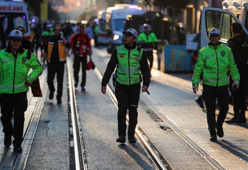 Police officers walk near the scene after an explosion on busy pedestrian Istiklal street in Istanbul, Turkey, November 13, 2022. REUTERS/Kemal Aslan