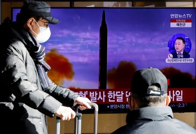 A man walks past a TV broadcasting a news report on North Korea firing a ballistic missile off its east coast, in Seoul, South Korea, December 18, 2022. REUTERS/ Heo Ran