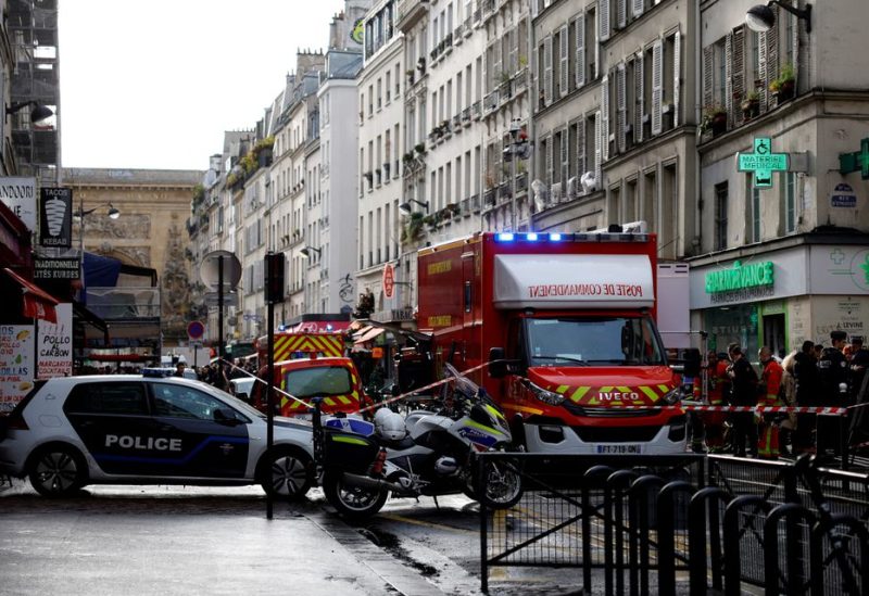 French police and firefighters secure a street after gunshots were fired, killing two people and injuring several, in a central district of Paris, France, December 23, 2022. REUTERS/Sarah Meyssonnier/
