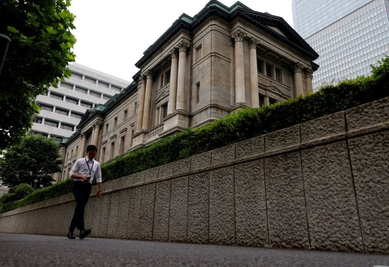 A man walks past Bank of Japan's headquarters in Tokyo, Japan, June 17, 2022. REUTERS/Kim Kyung-Hoon/File Photo