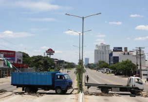 Trucks block a street as part of a "general strike" following the detention of Santa Cruz opposition governor Luis Fernando Camacho, for whom prosecutors are seeking pre-trial detention in connection to the 2019 political unrest, in Santa Cruz de la Sierra, Bolivia, December 30, 2022. REUTERS/Lesly Moyano