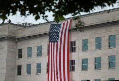 U.S. flag hangs during a ceremony to honor victims of the September 11, 2001, attacks at the Pentagon in Washington, U.S., September 11, 2022. REUTERS/Cheriss May