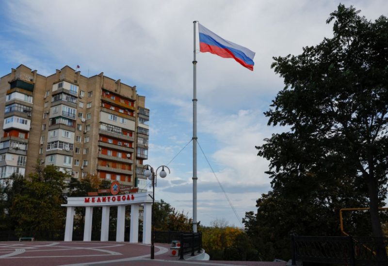 A flag flies in a square in the course of the Ukraine-Russia conflict in the city of Melitopol in the Zaporizhzhia region, Russian-controlled Ukraine October 13, 2022. REUTERS/Alexander Ermochenko/File Photo