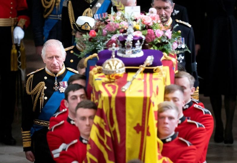 Britain's King Charles and members of the royal family follow behind the coffin of Britain's Queen Elizabeth, draped in the Royal Standard with the Imperial State Crown and the Sovereign's orb and sceptre, as it is carried out of Westminster Abbey after her State Funeral, London, Britain, September 19, 2022. Danny Lawson/Pool via REUTERS/File Photo