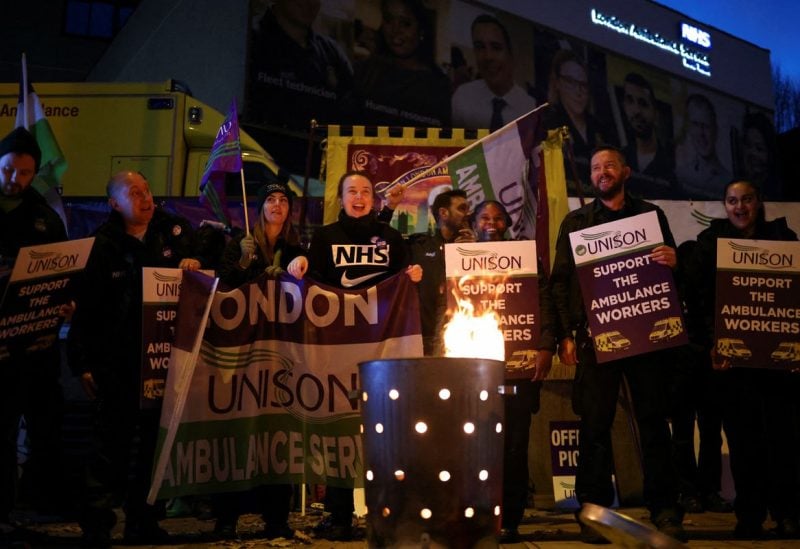 Ambulance workers take part in a strike, amid a dispute with the government over pay, outside NHS London Ambulance Service in London, Britain December 21, 2022. REUTERS/Henry Nicholls/File Photo