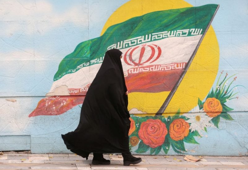 A woman walks after the morality police shut down in a street in Tehran, Iran December 6, 2022. Majid Asgaripour/WANA (West Asia News Agency) via REUTERS