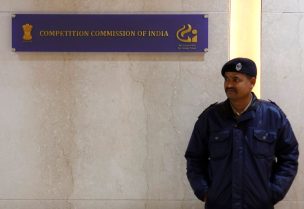 A security guard stands outside the Competition Commission of India (CCI) headquarters in New Delhi, India, January 13, 2020. REUTERS/Adnan Abidi/File Photo