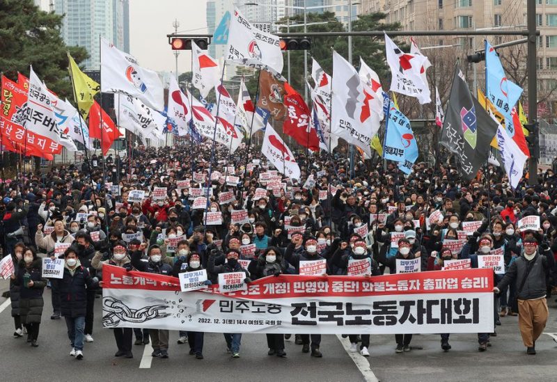 South Korean workers from the country's biggest labour union march during a rally in support of the ongoing strike by truckers near the National Assembly in Seoul, South Korea December 3, 2022. Yonhap/via REUTERS