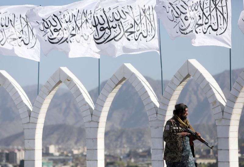 A Taliban fighter is seen at the Taliban flag-raising ceremony in Kabul, Afghanistan, March 31, 2022. REUTERS/Ali Khara