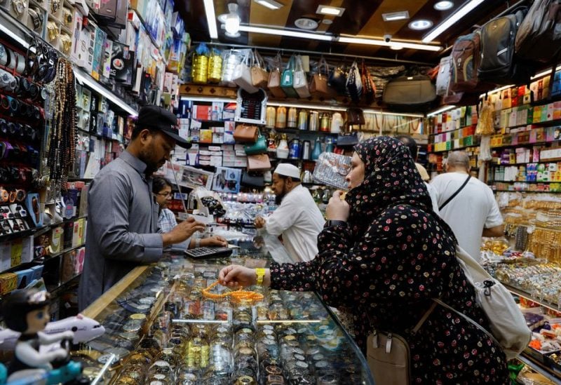 A Muslim pilgrim shops in Mecca, Saudi Arabia July 5, 2022. REUTERS/Mohammed Salem