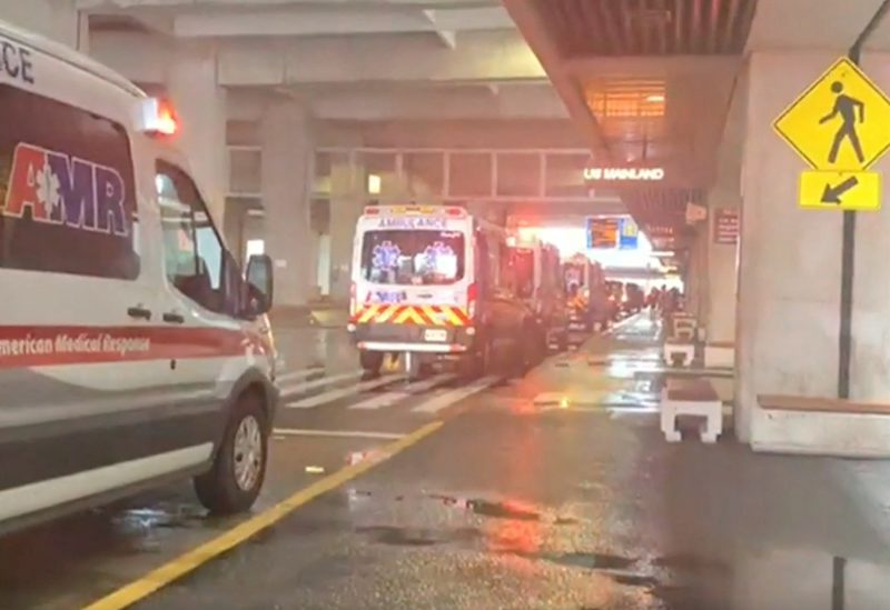 Ambulances stand by at the airport after a Honolulu bound flight from Phoenix experiences severe turbulence, injuring dozens - REUTERS