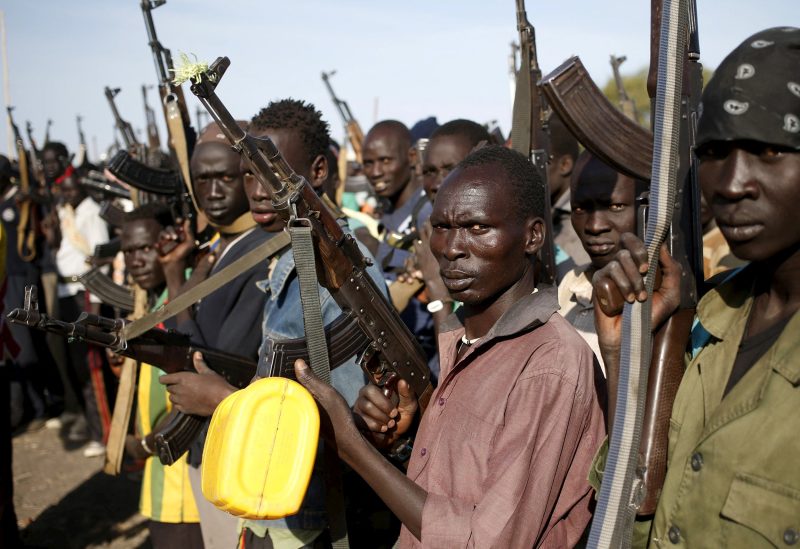 Jikany Nuer White Army fighters holds their weapons in Upper Nile State, South Sudan February 10, 2014. South Sudan's rebels said on Tuesday that government soldiers had launched attacks against their positions in oil-rich Unity State in what they said was a violation of a peace deal signed in August. Picture taken February 10, 2014. REUTERS/Goran Tomasevic/File Photo