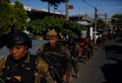 Troops walk in the suburb of Soyapango, after El Salvador's President Nayib Bukele announced the deployment of 10,000 security forces to the troubled area which for years has been considered a stronghold of the violent Mara Salvatrucha and Barrio 18 gangs, in San Salvador, El Salvador December 3, 2022. REUTERS/Jose Cabezas