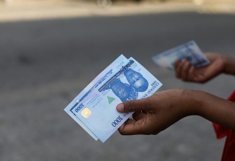 A person holds a new 1000 Naira note as the Central Bank of Nigeria releases the notes to the public through the banks in Abuja, Nigeria, December 15, 2022. REUTERS/Afolabi Sotunde