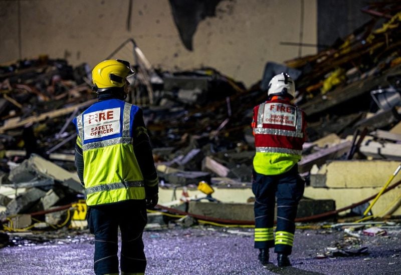 Search crew work at a blast site at a block of flats in Saint Helier, on the island of Jersey, Britain December 10, 2022 in this picture obtained from social media. Government of Jersey via Twitter/via REUTERS