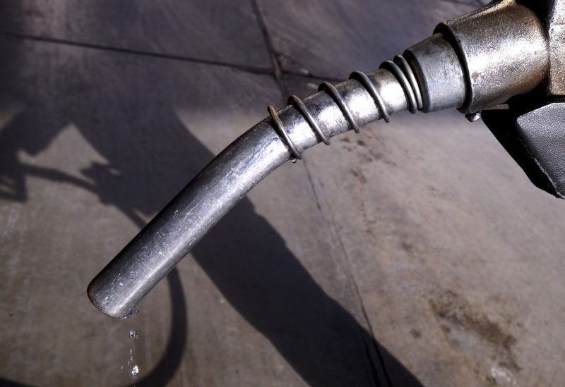 A worker grabs a nozzle at a petrol station in Tehran, Iran January 25, 2016. REUTERS/Raheb Homavandi